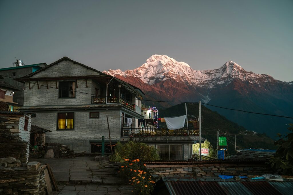 a house with a mountain in the background